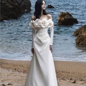 Elegant wedding dress with unique floral shoulder design